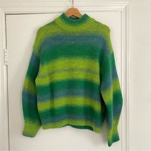 COS Striped Wool Mock-Neck Sweater with green ombré stripes.